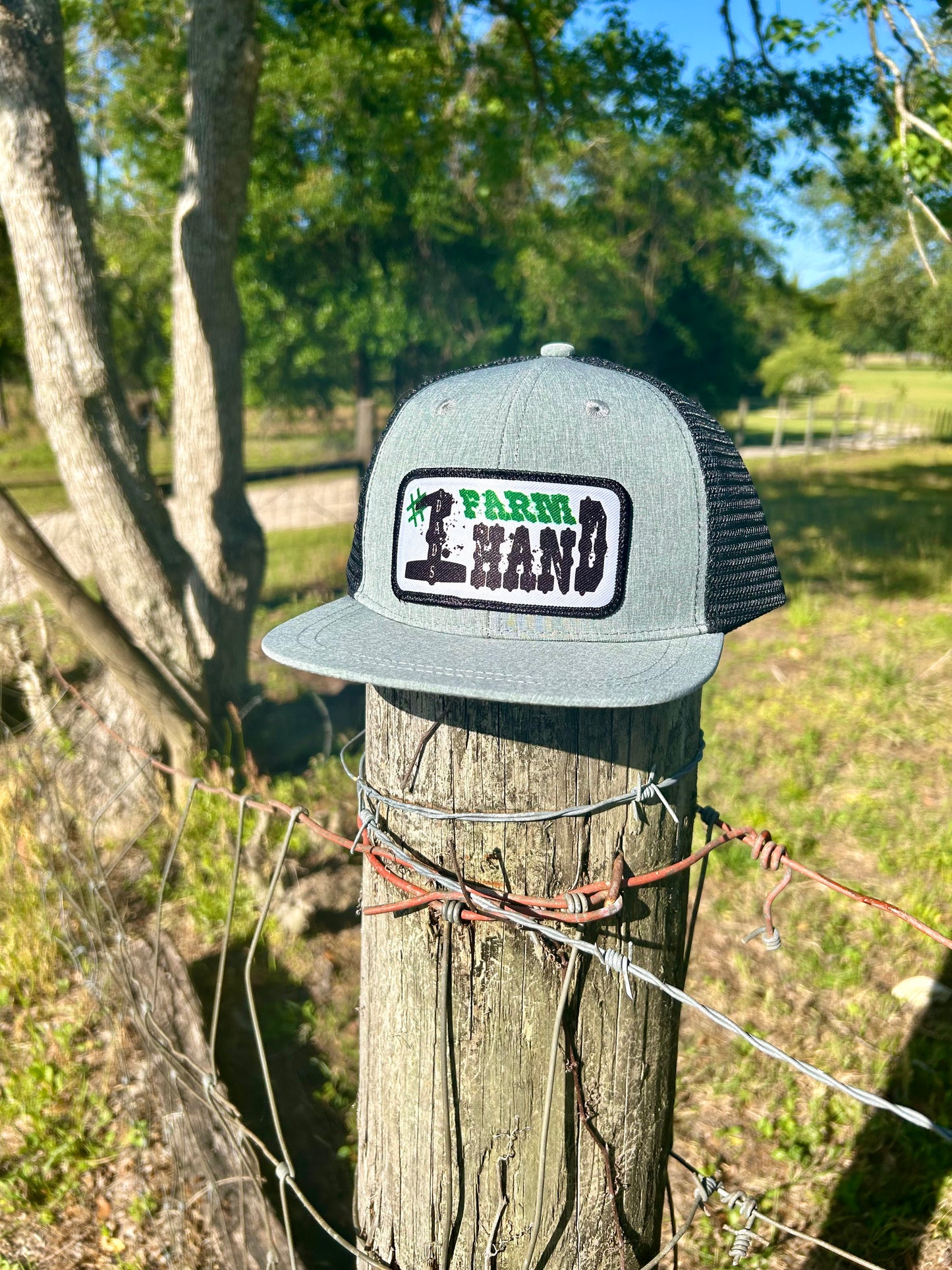 Grey ball cap with black mesh, for infants and toddlers with a #1 Farm Hand hat patch.